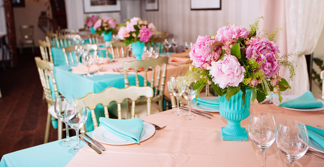 Beautiful bright bouquet of peony on the wedding table