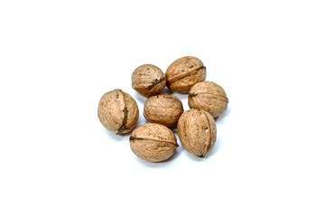 Inshell walnuts. Quantity - seven pieces. Centered on a white background. Close-up.