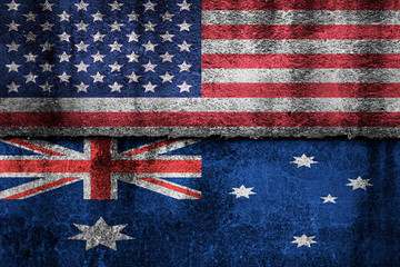 two flags on a cracked wall, USA and Australia