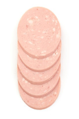 Boiled sausage slices, top view, isolated on white background