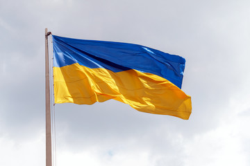 national flag of Ukraine on the gray sky background