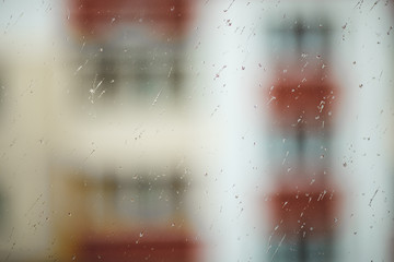Raindrops on the glass. urban texture background