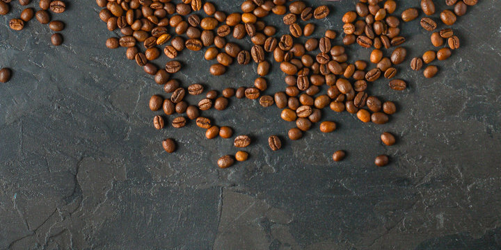 coffee beans (good and bad grain) - arabica and robusta blend (roasted coffee grain). Black background. Top view . Copy space.