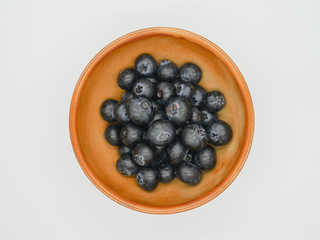 Large blueberries in a ceramic bowl