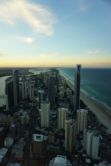 Skyline of Gold Coast, Brisbane, Australia during sunset, with both skyscrapers and beach in the foreground, as well as the sea in the horizon
