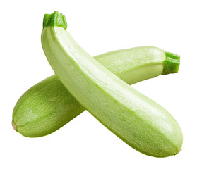 Two fresh green courgettes or zucchini criss-cross isolated on white background. Fresh vegetables, vegetarianism and healthy eating.