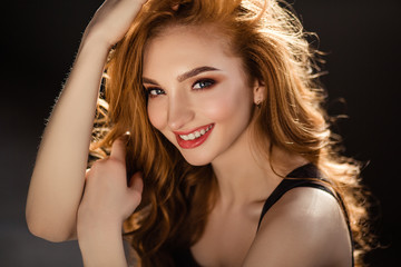 Fototapeta premium brunette girl with curly hair/advertising