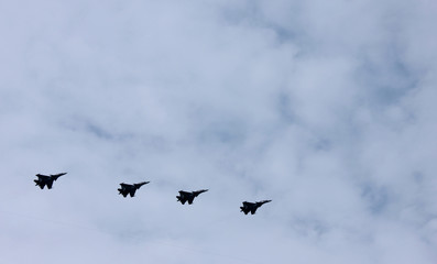 Military jet planes of Russian army aviation flying in St. Petersburg, Russia 