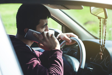 man hand phone in car