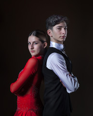 Beautiful young dancers in ballroom isolated on black background