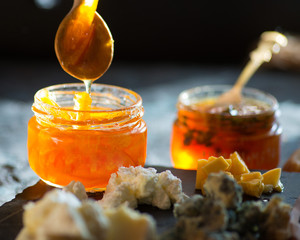 orange.  confitures.  and marmalades.to various cheeses on a plate. Breakfast with coffee and...