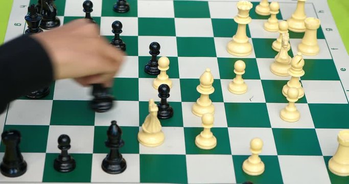 Young boys play chess battle with coming checkmate, 4K