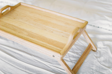 wooden table breakfast tray in bed