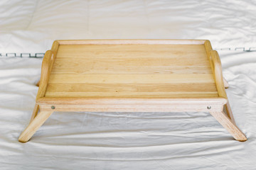 wooden table breakfast tray in bed