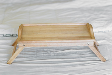 wooden table breakfast tray in bed