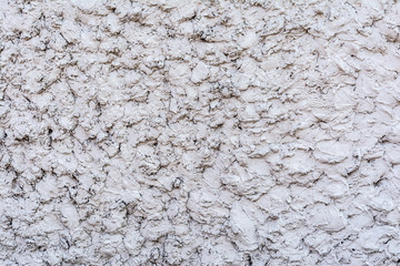 gray texture of a concrete wall, layer of decorative plaster, abstract background