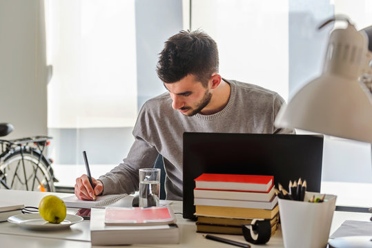 Young Man, College Student Studying For An Exam