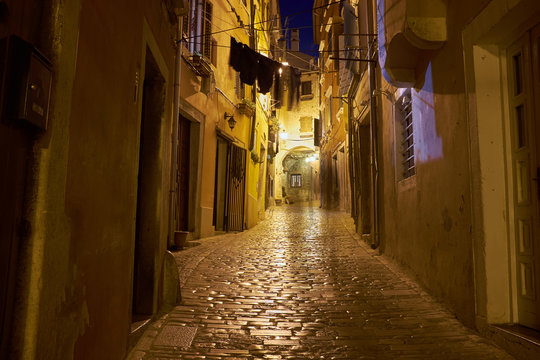 Rovin&rsquo;s old town street at night in warm colors