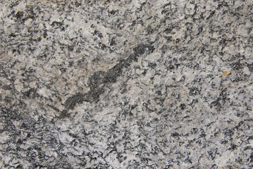 Grey old granite rock with quarts as background