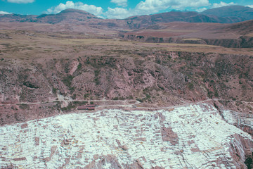 Maras Salt Flats Landscape with Pools of White Salt - Peru