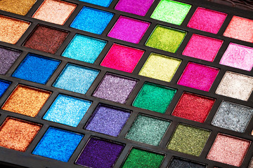 palette of multi-colored eyeshadow closeup, makeup cosmetics