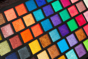 Closeup photo of box with multicolored eyeshadow palette, make-up artist set