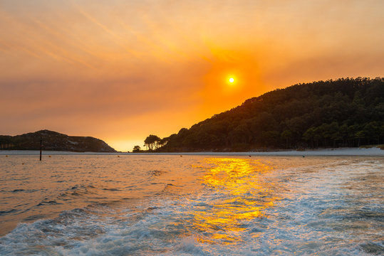 Sunset in the estuary of Vigo, Cies islands as background, Galicia, Spain