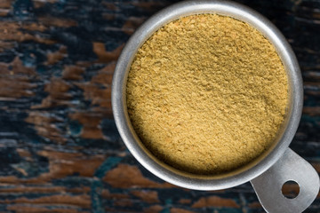Nutritional Yeast in a Measuring Cup