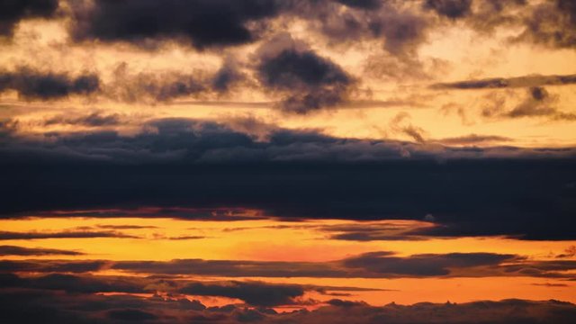 Timelapse of dark stormy sky with clouds at night