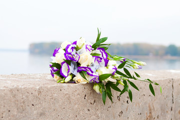bouquet of purple eustomas and white roses