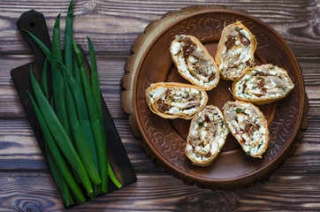 Obraz na płótnie Canvas Snack from pita cheese fish and greens