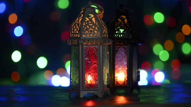 Low light studio set up shot of lighted lantern - showing ramadan kareem or eid mubarak celebration conceptual.