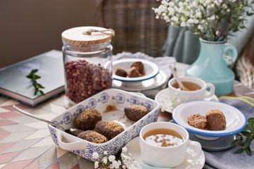 Traditional Russian cake with cocoa in the shape of a ball. Served breakfast table. Top view. Tea and dessert.