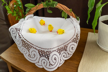 Polish traditional Easter basket with blessed food covered with white tray cloth. - 265695425