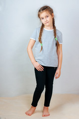 Little child girl posing at studio.Perfect portrait fashion kid. Beautiful face caucasian child 6-7 years.