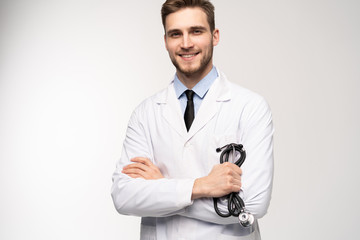Smiling medical worker in white coat isolated on white.