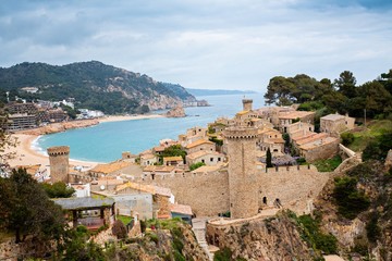 Fototapeta na wymiar Stone castle and fortress on tourist track in Tossa de Mar