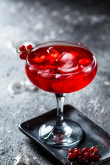 red cocktail with ice vapor. Cocktail with smoke. Alcohol drink, vodka, ice, party, dry ice.