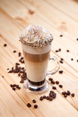 cup of coffee on the wooden background