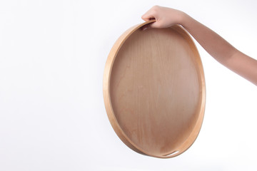 Hand and wooden tray isolated on white background