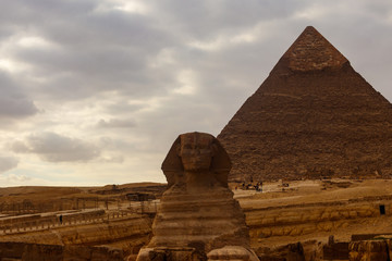 Fototapeta na wymiar Egyptian Great Sphinx and pyramids of Giza in Cairo, Egypt