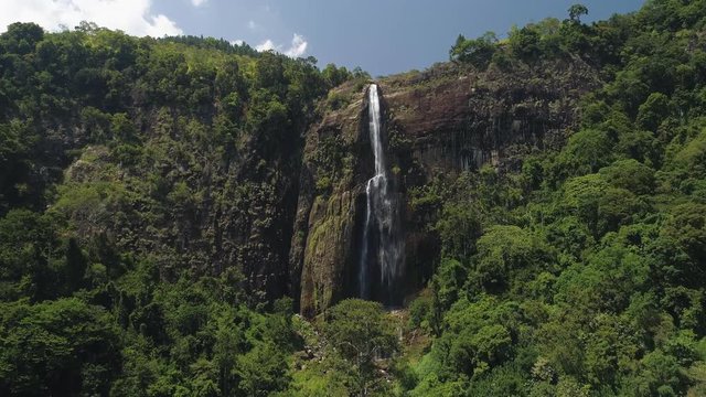 Flying towards tall Diyaluma Falls, picturesque landscape of Sri Lanka