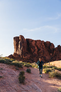 Senior Asian Woman Hiking In Valley Of Fire State Park, Nevada, North America