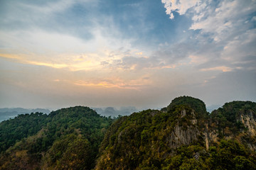 Landscape view at the top of Wat Tham Sua or Tiger Cave Temple in Krabi province. Mountains and sunset sky 