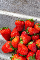 red strawberries scattered gray background