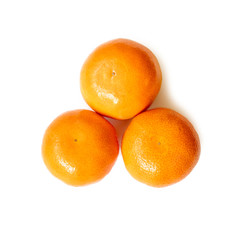 Three ripe fresh tasty juicy tangerines or clementine mandarins  isolated on white