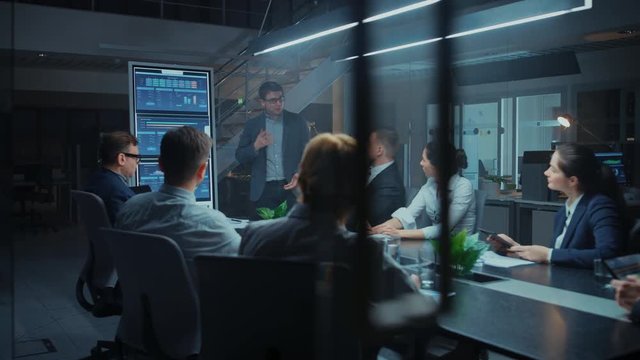 In the Corporate Meeting Room: Energetic Young Startup Creator Uses Digital Interactive Whiteboard for Presentation and Delivers Powerful Speech to a Board of Executives Investors and Businesspeople