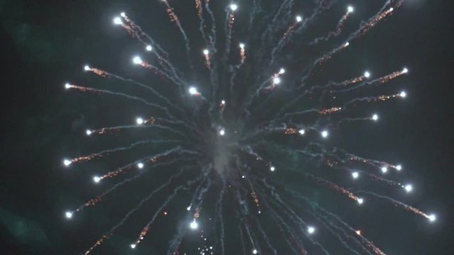 Fireworks with Twinkling Embers in Night Sky TILT UP SLOW MOTION