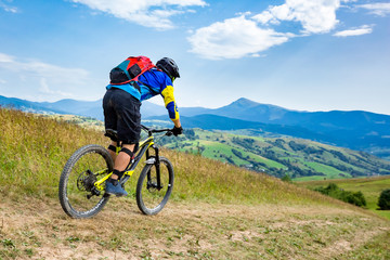 Fototapeta na wymiar Professional enduro rider and mountain range. Carpathian mountains.