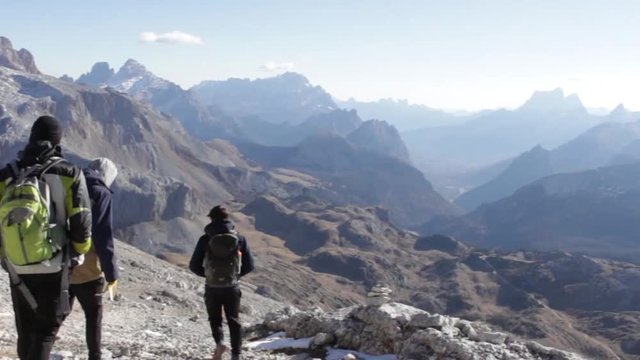A sunny hiking day in the alps with a great view over the mountains of the dolomites